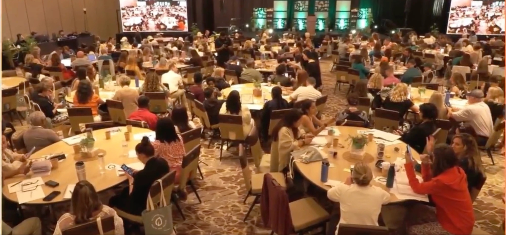 The Renew 2025 ballroom, roughly 250 Brand Partners at round tables facing the stage